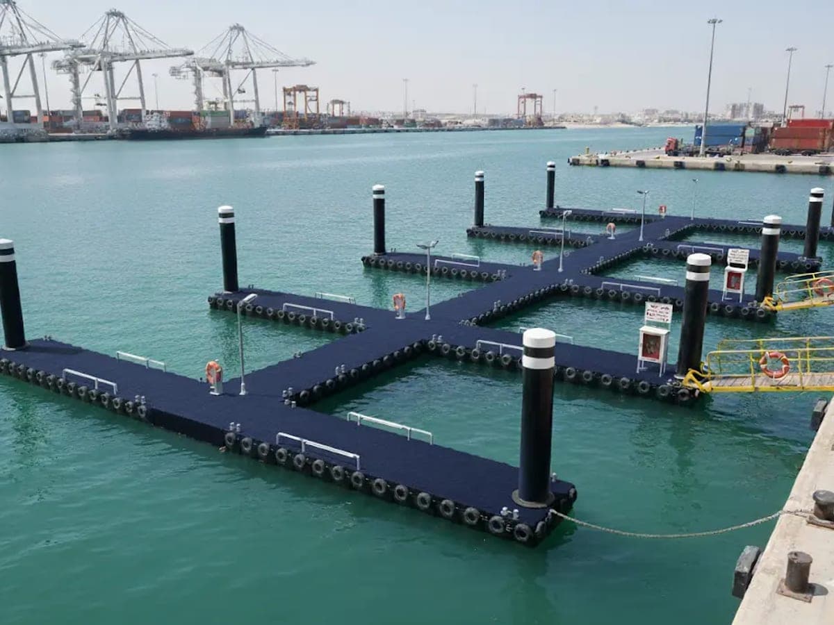 An Acquafront modular floating jetty in a port.
